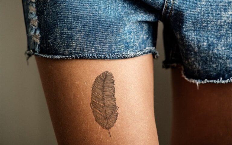 pretty simple thigh tattoos