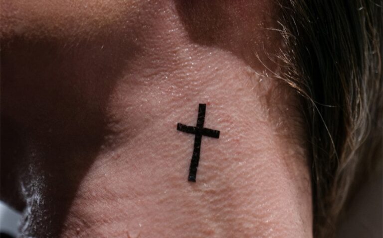 women's feminine cross tattoo